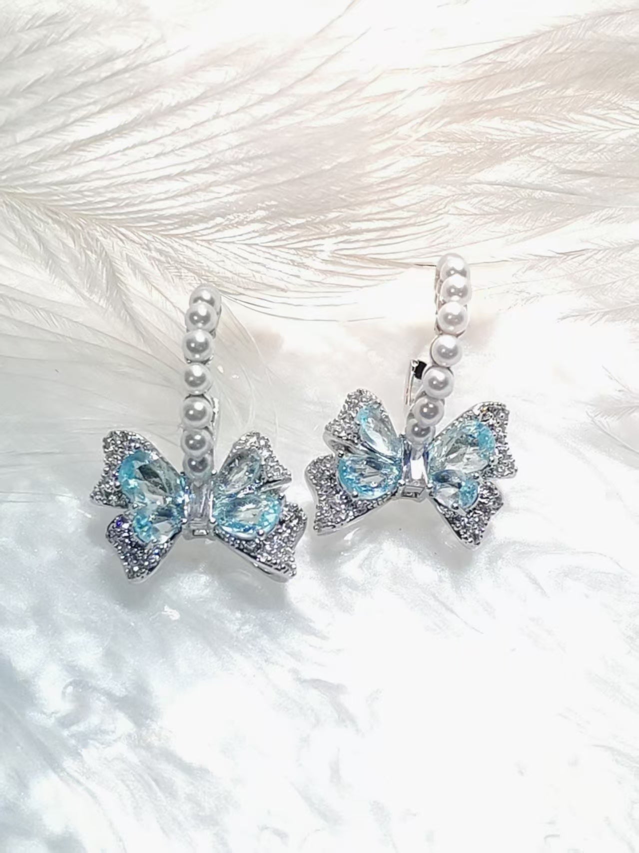 S925 - Pearly Bluey Bow Earring